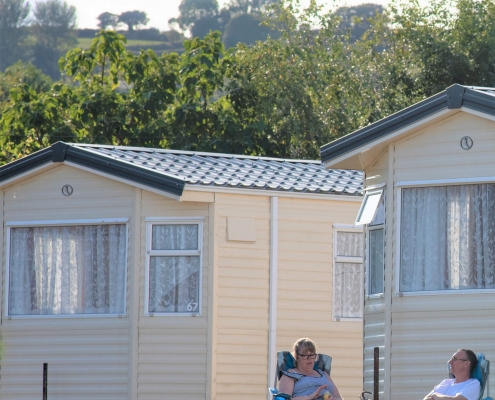 Guests sat outside holiday home